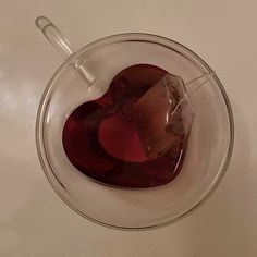 a heart shaped piece of chocolate in a glass bowl