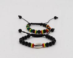 These lovely, Jamaican rasta color bead bracelets were handmade in West Africa. This versatile wrist wear represents a symbol of a connection to the birthplace of humankind and can be used as an accessory to add a splash of color to any outfit. The length is conveniently adjustable for men, women and teens.  In stock. Fast shipping from Dallas, TX. Casual Bracelets With Wooden Beads As Gift, Casual Friendship Bracelets With Black Beads As Gift, Casual Black Beads Wristband Gift, Casual Braided Bracelets With 8mm Beads For Gifts, Casual Adjustable Braided Bracelets With 8mm Beads, Casual Black Friendship Bracelets With 8mm Beads, Casual Black Friendship Bracelets With Round Beads, Casual Wooden Beads Jewelry As Gift, Casual Black Round Beads Friendship Bracelets