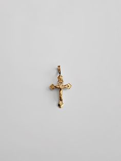 "Proclaim your love and believe in Christianity in the most sophisticated way. Highlight the power of your faith in Jesus Christ and His sacrifice through this 14K solid gold cross pendant. The minimalist cross pendant exquisitely represents the long-standing Christian faith through its elegant finish. Finely cut edges showcase utmost precision, giving the cross pendant a neat appeal that is captivating to the eyes. 100% tarnish-free, this solid gold pendant will shine as radiant as your faith i 14k Gold Crucifix Spiritual Jewelry, 14k Gold Spiritual Crucifix Jewelry, Spiritual Cross Pendant In Tarnish-resistant Material, Spiritual Cross Pendant Jewelry, Tarnish Resistant, Spiritual Tarnish Resistant Cross Pendant Jewelry, Spiritual Tarnish-resistant Cross Pendant Jewelry, 14k Gold Crucifix Necklace Spiritual Style, 14k Gold Crucifix Cross Necklace, 14k Gold Crucifix Necklace For Spiritual Wear