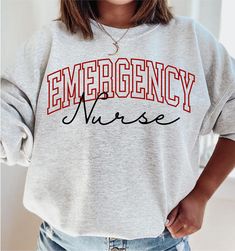 Emergency Nurse Sweatshirt, Emergency Nurse Hoodie, Emergency Department Sweatshirt, Emergency Department Hoodie, ER Nurse Sweatshirt How to Order 1* View all color and size charts before you place your order. 2* Select your shirt "SIZE" and "COLOR". 3* Click add to cart.  If you are ordering more than 1 item, you need to repeat this process for each item you wish to order. Product Information Gildan Hoodie- Sweatshirt 8 oz.(US) 13.3 oz.(CA), 50/50 preshrunk cotton/polyester Heather Sport colors: 60/40 polyester/cotton Air jet yarn = softer feel and reduced pilling Double needle stitching at shoulder, armhole, neck, waistband and cuffs 1 x 1 rib with spandex Quarter-turned to eliminate center crease Safety Green: Compliant with ANSI / ISEA 107 Tearaway label Washing Care Instructors Use co Emergency Nurse, Nursing Hoodie, Emergency Nursing, Er Nurse, Nurse Sweatshirt, Emergency Department, Gildan Hoodie, Size Charts, Sweat Shirt