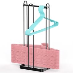 a pink and black rack with two pairs of blue handles on top of it, in front of a white background