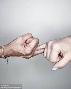 two people reaching out their fingers to each other