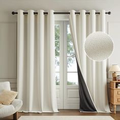 a living room with white and black curtains