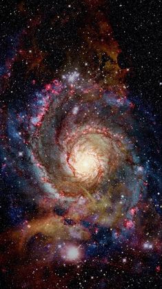 an image of a spiral galaxy with stars in the background and blue, red and yellow colors