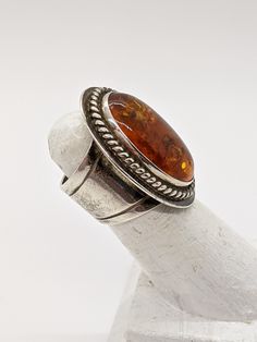 Sterling Desert Rose Trading Amber Ring - Sterling Jay King Large Oval Amber Ring - Wide 925 Amber Ring - Southwestern Amber Ring Size 5. This ring is Sterling Silver and has a wide Sterling band & setting with a gorgeous large oval Amber stone. Ring measures size 31mm x 22mm with a 14mm band at it's widest. Hallmarked and tested sterling with DTR maker's mark. Very good condition. This is one not to miss! Great Gift for Her! FREE DOMESTIC SHIPPING! VISIT OUR NEW Etsy Shop Sections For Handc Luxury Heirloom Amber Jewelry, Amber Ring For Men, Southwestern Oval Rings For Anniversary, Southwestern Oval Anniversary Rings, Southwestern Anniversary Rings, Yellow Stone Rings, Wake Forest Nc, Wake Forest, Amber Ring