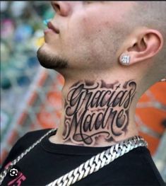 a man with a tattoo on his neck that says taco's mada