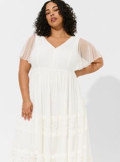 FIT Model is 5'10” wearing size 2. . MATERIALS + CARE Lace woven fabric. 90% nylon, 10% spandex. Machine wash cold. Dry flat. . Imported. DETAILS V-neck. Lace detail. Lined. Flutter sleeves. WHY WE LOVE IT Calling all you desert princesses, bohemian beach beauties, and mountain top queens! Nothing is more chic than a beautiful lace and Swiss-dot gown, and if boho is your style then we can guarantee this wedding dress from our Ever After collection will be the dress of your dreams. The best plus size women's ivory lace a-line boho wedding dress skater dresses in cloud dancer made of lace. Rock your look from Torrid to Festivals like Coachella and Lollapalooza, a concert, a show, or just for fun! This sexy dress will show off your confidence for going out to a cocktail party, date night, gir Stretch A-line Dress For Wedding, Stretch A-line Wedding Dress, Black Beachwear, Embroidered Mesh Dress, Lace Weave, Midi Skater Dress, Skater Dresses, Cloud Dancer, Maxi Jersey Dress