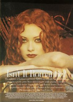 a woman with red hair and green eyes is featured in the magazine's cover