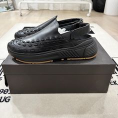 Brand New In Box. Comes With Dustbag In Card. Bottega Veneta Laced Detail Speedster Sneaker Mules / Clogs In Storm Leather In Black Bnib Size 43e Eu / 10us Fits A Bit Smaller. Feels Like A True 9.5us. But Please Know Your Own Preferences On Bottega Sizing. Storm Cuir Colorway. Dad Shoes Style Mules / Clogs. Made In Italy. Msrp: $1050 After Tax. Fb Bensurbanbargain Luxury Clogs With Rubber Sole And Round Toe, Modern Black Slip-on Clogs, Luxury Clogs With Rubber Sole And Closed Toe, Luxury Closed Toe Clogs With Rubber Sole, Black Clogs With Studded Rubber Outsoles And Round Toe, Modern Black Clogs With Textured Sole, Modern Black Round Toe Clogs, Designer Leather Clogs With Rubber Sole, Designer Leather Clogs With Round Toe