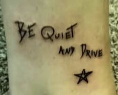 a tattoo saying be quiet and drive with stars on it