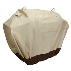 a white and brown grill cover on top of a table