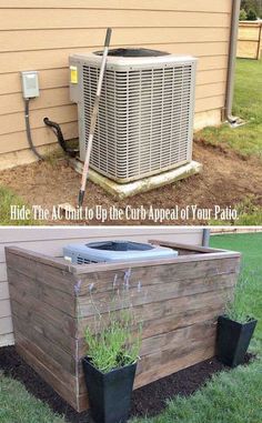 an air conditioner sitting on top of a wooden planter box next to a building