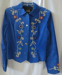 For your consideration is a beautiful Western style jacket made of genuine pig split leather.  Royal blue in color with beading and scroll work embroidery.  Western buttons and the "V" front hem.  Made by North American Frontier.  Marked size M.  Measures:  Bust 38", waist 35", length from shoulder seam 24" to points, back from collar to hem 22 1/2" and sleeves from shoulder seam to hem 25".  Fully lined.  Clean, no stains. Please email with any questions. Fitted Blue Western Outerwear, American Frontier, Scroll Work, Pig Skin, Western Style, Western Fashion, Varsity Jacket, North American, Royal Blue