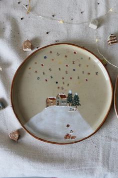 a plate with christmas decorations on it sitting on a table