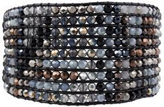 a stack of bracelets with grey and black beads on it's ends,