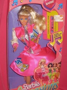 the barbie doll is wearing a pink dress