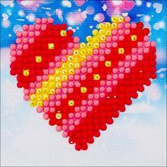 an image of a heart made out of legos in the sky with stars and bubbles