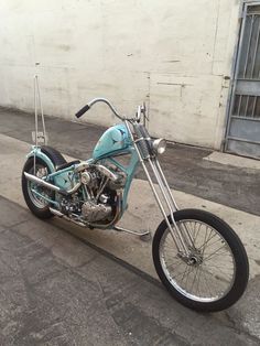 a blue motorcycle is parked on the street