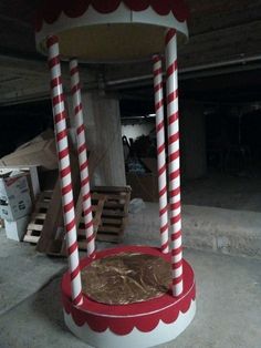 a carnival ride with two giant candy canes on it's top and bottom