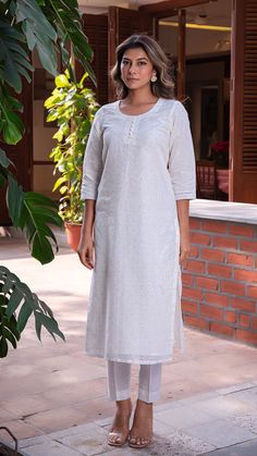 Comfortable kurta made in pure linen fabric with hand embroidered tikkis. Matching straight narrow pants. An absolute all-season essential - cool in summer and warm in winter. Features a round neck. Quarter sleeves. Fully lined kurta. Kurta Fabric : Linen. Pants Fabric : Cotton Linen. Model height is 5.6” and is wearing a size S. Wash Care : Dry Clean Only. Linen Straight Kurta With Resham Embroidery, Straight Linen Kurta With Resham Embroidery, Linen Kurta With Resham Embroidery, Traditional Linen Kurta With Resham Embroidery, Unstitched Linen Straight Kurta, Embroidered Linen Kurta, Festive Linen Kurta With Embroidered Border, Fitted Linen Kurta With Chikankari Embroidery, Festive Linen Kurta For Summer