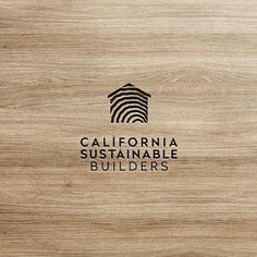 a wooden background with the california suitable builder logo