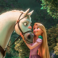 the princess and her horse are hugging each other