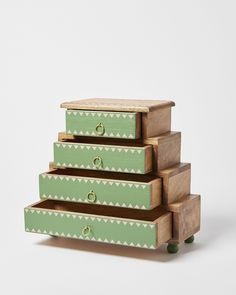 three wooden drawers stacked on top of each other