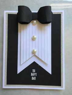 a black and white card with a bow tie on it's side, which says diy happy day