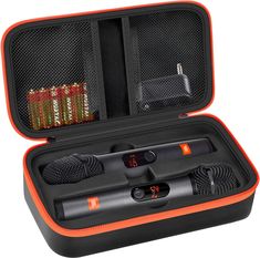 an orange and black case holds two microphones, one with a mic in it