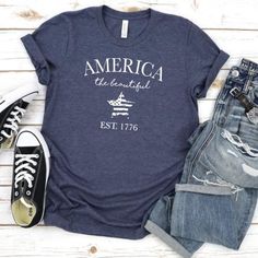 Our shirts are handmade in Ohio by hand with love and care one at a time.We hope you will find a shirt that will inspire you or someone else.This America the beautiful shirt is a must. We use a high-quality unisex t-shirt that is insanely soft. In fact, it will be one of the softest, best fitting, most comfortable shirts you’ve ever owned.CLICK BELOW 👇👇👇👇👇👇👇https://www.etsy.com/shop/WalnutRidgeCoDETAILS:- This is for 1 graphic shirt.- Available in sizes S-2XL- These are UNISEX fit.- Pleas Trendy Cotton T-shirt For Independence Day, Pre-shrunk Tri-blend Summer Shirt, Summer Shirt With Text Print For Everyday, Casual Soft-washed T-shirt For 4th Of July, Casual Independence Day Shirt With Text Print, Summer Tri-blend Crew Neck Shirt, Casual 4th Of July Shirt With Screen Print, Relaxed Fit Cotton Shirt For Independence Day, Casual Screen Print Shirt For 4th Of July