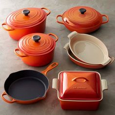 an assortment of pots and pans on a table