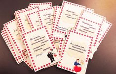 five cards with wedding pictures on them sitting next to each other in front of a black table