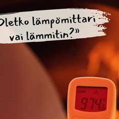 a thermometer sitting on top of a table next to a burning fireplace with a sign that reads deltto lamponittari vialamitin?