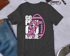 a t - shirt with the words go pink for my home on it next to some jeans