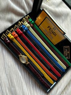 This is a rare, vintage FENDI Orologi Watch with Multi Color Leather Straps from the 1980s. Extremely hard to find in this excellent condition! DESCRIPTION: -Stainless steel -White dial -Gold plated -Includes 9 original Fendi genuine leather straps (with Fendi stamped on the back of each strap) -There are different types of leather straps (different textures)-Includes original box and case with Fendi tags -Swiss Made -Movement: Quartz-Battery -100% Authentic MEASUREMENTS: The leather strap is adjustable and fits wrist size up to 7 inches/17.8 cm. CONDITION: This watch is in excellent to mint vintage condition. Most of the leather straps are in mint condition and only the black strap shows signs of normal wear. It is fully functional and keeps time. I try to highlight every detail as much a Luxury Vintage Jewelry And Watches As A Gift, Vintage Watch Claw, Luxury Vintage Rectangular Watch Bands, Cheap Vintage Watches With Bracelet Strap, Fendi Vintage, Vintage Fendi, Close Up Pictures, Women Wrist Watch, White Dial