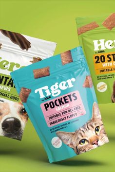 three bags of cat treats on a green background