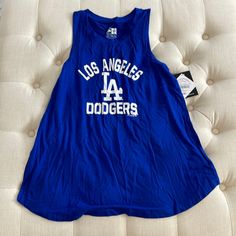 Dodger Tank Top Casual Tank Top For Game Day In Summer, Casual Summer Tank Top For Game Day, Blue Graphic Print Tank Top For Spring, Spring Blue Graphic Print Tank Top, Blue Casual Tops For Game Day, Trendy Blue Letter Print Tank Top, Blue Sleeveless Sports Season Tops, Trendy Blue Tank Top For Streetwear, Athleisure Tops For Game Day In Summer