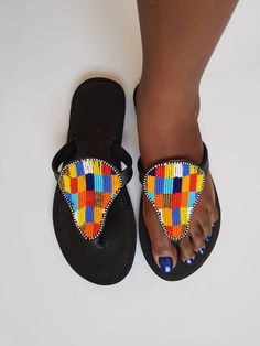 Maasai sandals made with high quality leather and colorful fine beads. **This listing is for 10pair of sandals. All assorted colors and designs. * The sandals come in different sizes. From size 37 EU to 42 EU.(You can request the sizes you would like). This listing is for resellers or those who want to gift family and friends. Perfect for outdoor summer events , beach wear , festivals , African themed events etc. Buy multiple items and pay shipping for one item Only. Back to my shop; https://www Traditional Multicolor Sandals With Round Toe, Multicolor Round Toe Toe Ring Sandals For Festivals, Multicolor Leather Toe Post Sandals, Multicolor Toe Ring Sandals For Festival, Multicolor Open Toe Sandals For Festival, Multicolor Leather Sandals With Single Toe Strap, Multicolor Toe Post Flip Flops For Festival, Multicolor Single Toe Strap Flip Flops For Festivals, Multicolor Leather Flip Flops For Vacation