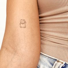 a person with a small tattoo on their arm