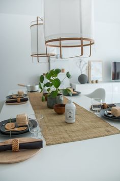 the table is set with plates, cups and utensils