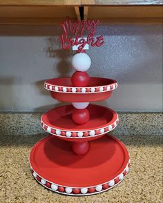 three tiered cake stand with happy birthday sign on top