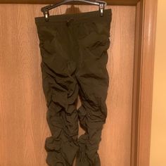 Nwot Joggers That Are 100% Nylon. They Are About 14” In The Waist And The Length Is About 26” Base On How They Are Made. Fitted Nylon Pants With Pockets, Fitted Nylon Parachute Pants With Elastic Waistband, Fitted Green Nylon Pants, Stretch Full-length Nylon Parachute Pants, Fitted Casual Nylon Parachute Pants, Fitted Nylon Parachute Pants, Green Nylon Long Pants, Green Nylon Cargo Bottoms, Fitted Nylon Bottoms With Cargo Pockets