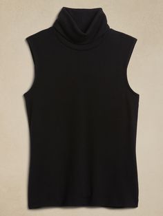 Winter Stretch Tank Top, Cozy Sleeveless Tops For Fall, Cozy Stretch Tops For Work, Stretch Turtleneck Tank Top For Winter, Winter Stretch Turtleneck Tank Top, Casual Fitted Turtleneck Tank Top, Solid Relaxed Fit Turtleneck Top, Chic Ribbed Turtleneck Tank Top, Fitted Cozy Sleeveless Sweater Vest