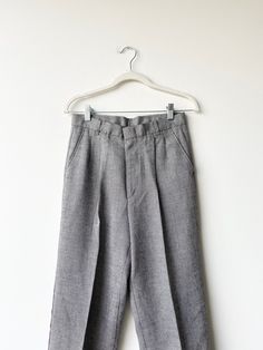 A pair of 1990s grey suit pants. Straight leg- mid rise. Zipper and latch button closure at waist. Brand is colter Waist 28 rise12 hips inseam 28 outer39.5 Classic Gray Pants For Spring, Classic Gray Wide Leg Dress Pants, Gray Formal Bottoms For Spring, Formal Gray Bottoms For Spring, Gray Flat Front Bottoms With Welt Pockets, Gray Flat Front Business Casual Bottoms, Gray Flat Front Bottoms For Business Casual, Gray Bottoms With Button Closure For Spring, Gray Full-length Bottoms With Welt Pockets