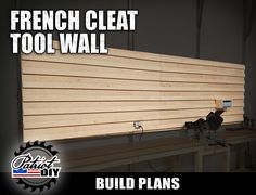 the french cleat tool wall is built with wood planks and screws