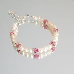 "This beautiful Pearl Bracelet for Newborn, Infant, Baby or Little Girl is made with 4mm Freshwater Pearls, Swarovski Bicones and sterling silver Daisy spacer beads. It includes a \"Grow with Me\" extender chain. S I Z I N G    G U I D E The bracelet should be 3/4\" larger than the child's snug wrist measurement. If you are unable to measure, you may use this guide for approximate bracelet sizing. 0-3 Months; 4\", 3-9 Months; 4.5\", 9-36 Months; 5\", 3-5 Years; 5.5\", 5-8 Years; 6\", 8-12 Years; 6.5\", 13+ Years; 7\", Other options available on request. PLEASE NOTE; Design is modified according to size." Hypoallergenic Round Bead Bracelets For Birthday, Hypoallergenic Pearl Jewelry For Birthdays, Adjustable Pearl Beaded Bracelet For Birthday, Beaded Pearl Jewelry For Birthday, Beaded Pearl Bracelet For Birthday, Round Beads Birthstone Bracelets For Birthday, Round Beaded Birthstone Bracelets For Birthday, Pearl Bracelet With Round Beads For Birthday, Pearl Bracelets With Round Beads For Birthday