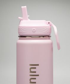 a pink insulated water bottle with a straw in the top and lid on a gray background