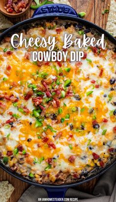 a cheesy baked cowboy dip in a cast iron skillet