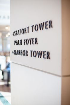 there is a sign on the wall that says seaport tower palm foyer harbor tower