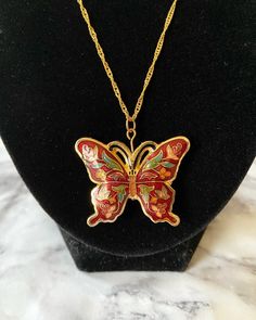 Vintage red floral puffy butterfly cloisonné enamel pendant on 18K gold plated wave chain.I cleaned the pendant to the best of my abilities.  The head pin and jump ring are 18K gold plated. Comes in a box. Please keep in mind that the pendant itself is vintage so it may show some signs of age/wear which includes any signs of chipping or tarnishing. If you need a chain of another length, please select in the menu. If you need a chain length not listed, please send me a message. If you would like Red Butterfly Charm Necklace, Red Enamel Round Pendant Necklace, Red Butterfly Necklace For Gift, Red Butterfly-shaped Jewelry Gift, Red Butterfly Jewelry For Gift, Red Enamel Jewelry With Large Pendant, Enamel Necklaces, Cloisonne Enamel, Head Pins